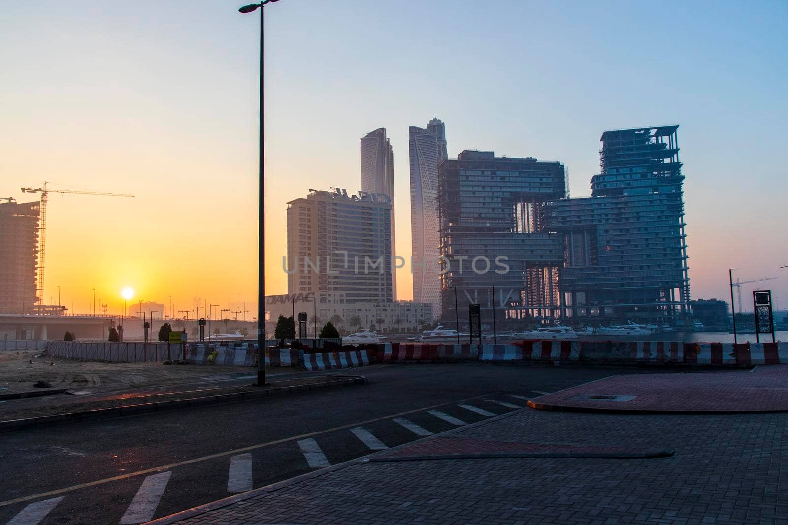 Dubai, UAE - 01.15.2021 Sunrise over a Dubai water canal. Outdoors by pazemin