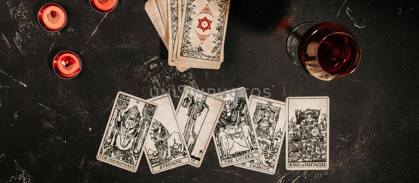 Tarot cards on red background, occult and magic by its_al_dente