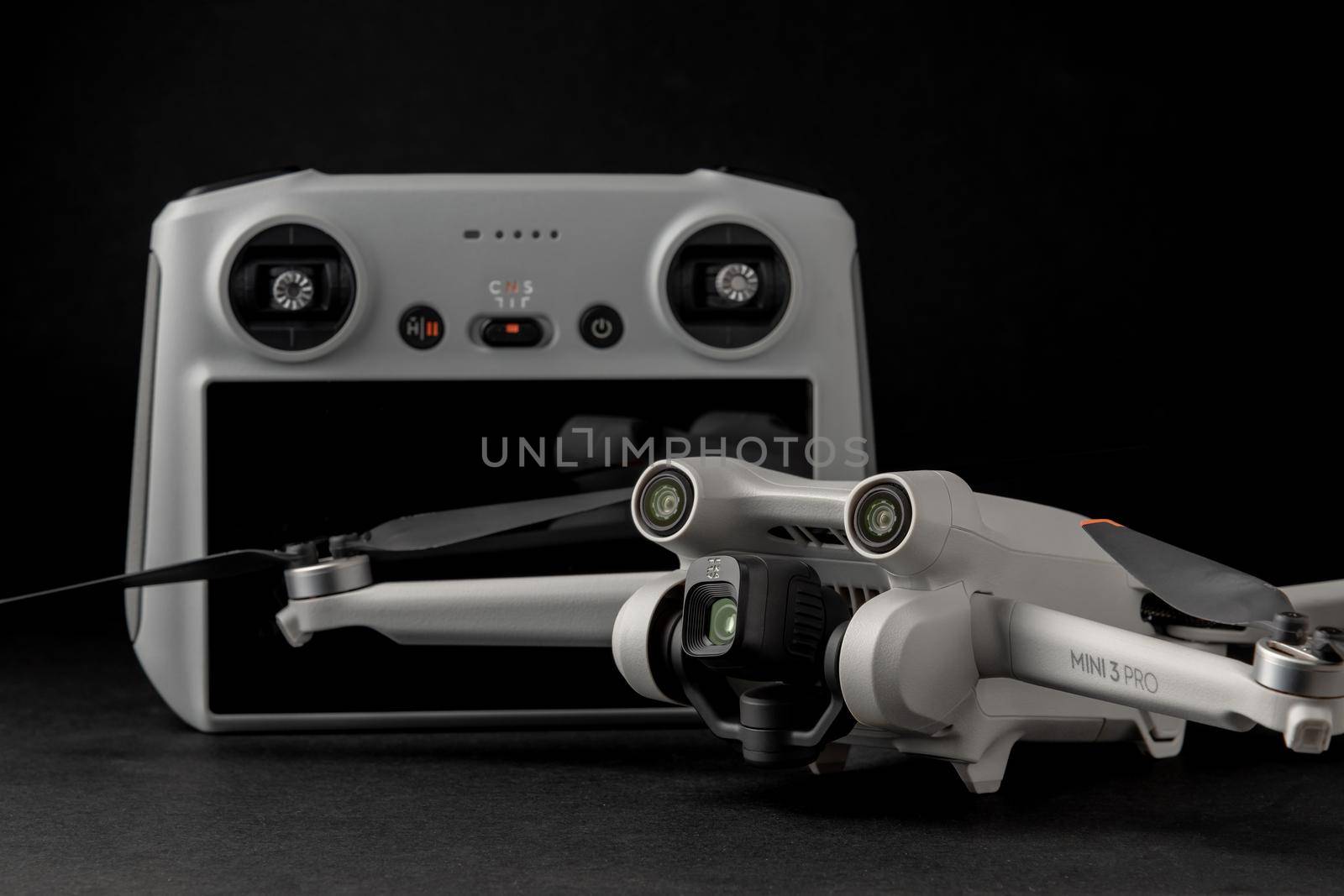 Antalya, Turkey - September 15, 2022: Mini 3 Pro drone of Dji brand with Vertical camera on dark background by Sonat