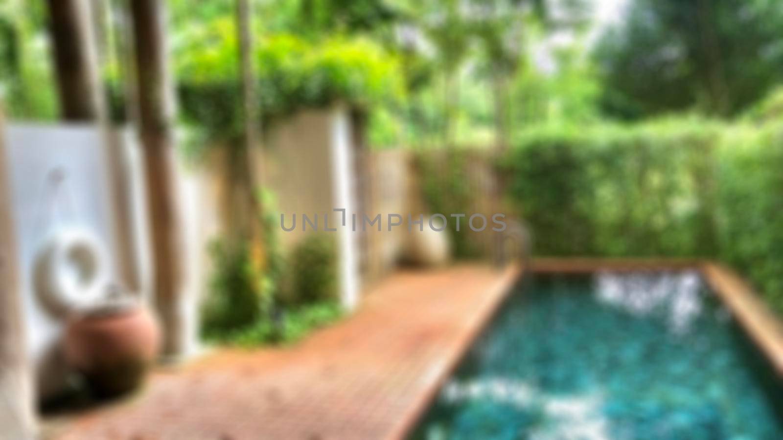 Blur Beautiful luxury swimming pool with palm trees , Thai style decoration. by Benzoix