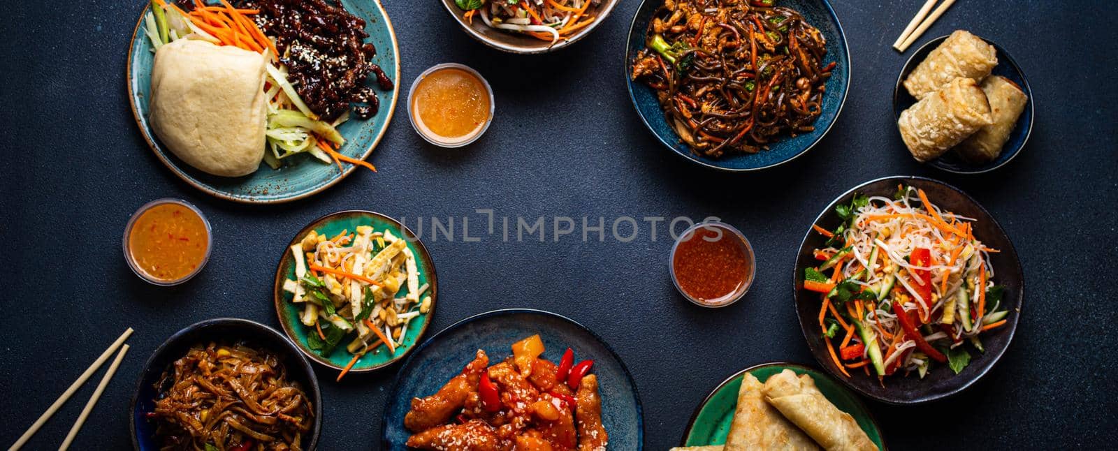 Set of Chinese dishes on table space for text by its_al_dente