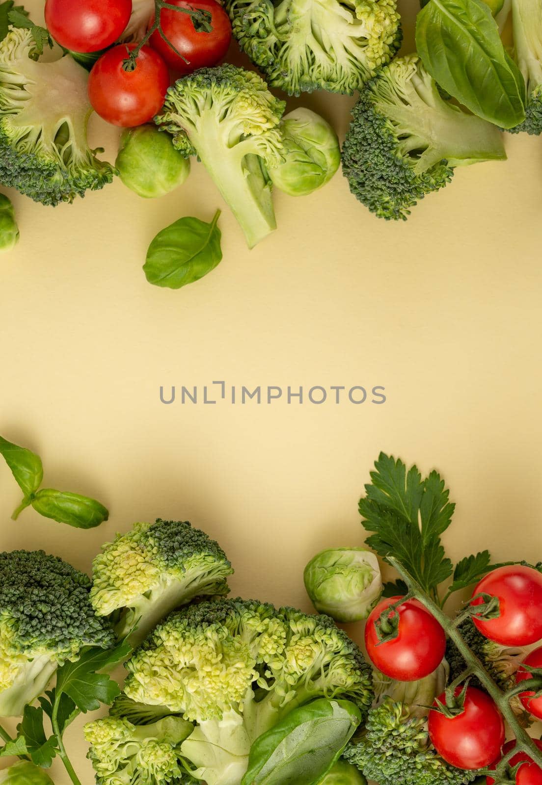 Vegetables food pattern made of broccoli, Brussels sprouts, tomatoes, herbs on light pastel background. Minimal flat lay design, nutrition, healthy eating, diets, vitamins. Top view, space for text