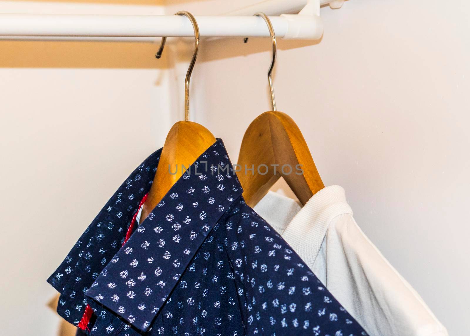 Close up shot of the shirts hanging on the rack. Clothing by pazemin