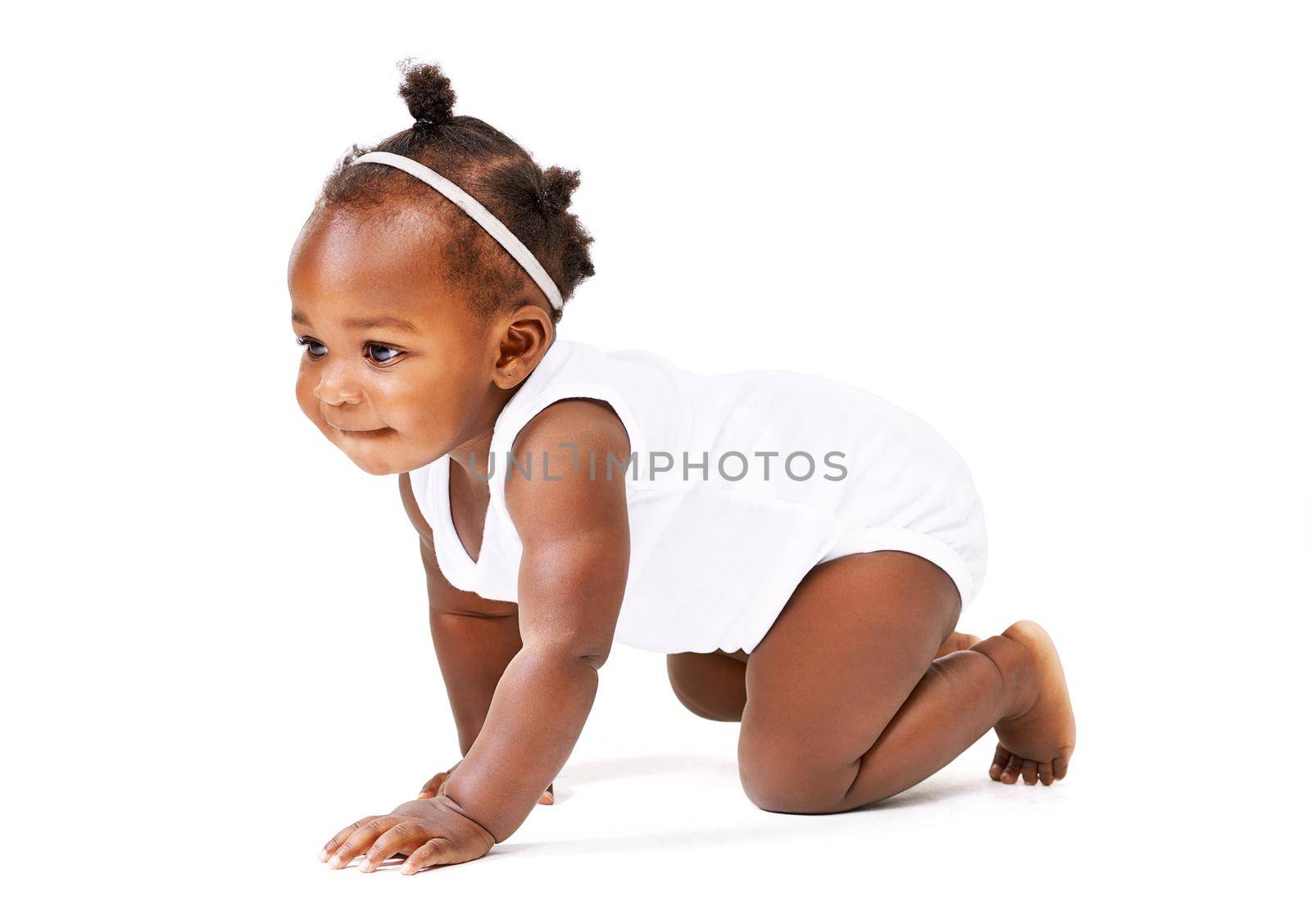 Time for an adventure. Studio shot of a baby girl crawling against a white background. by YuriArcurs