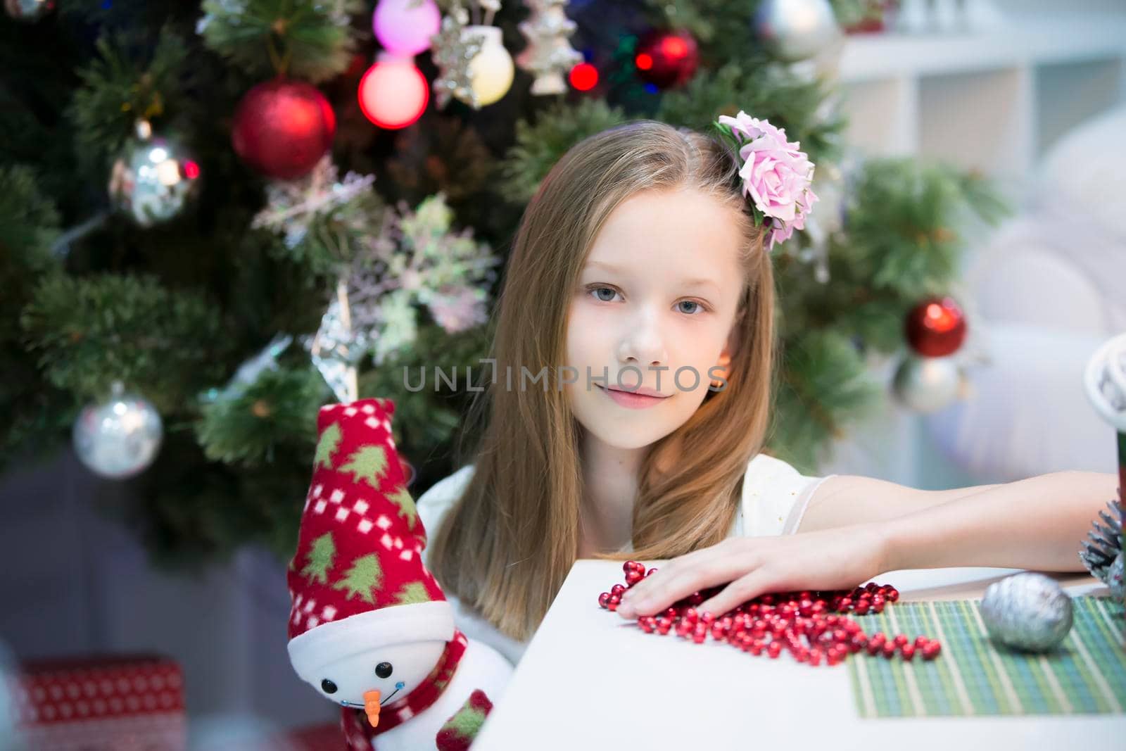 Beautiful girl in the new year. Celebrating Christmas. Portrait of teenage girl in New Year's holidays by Sviatlana