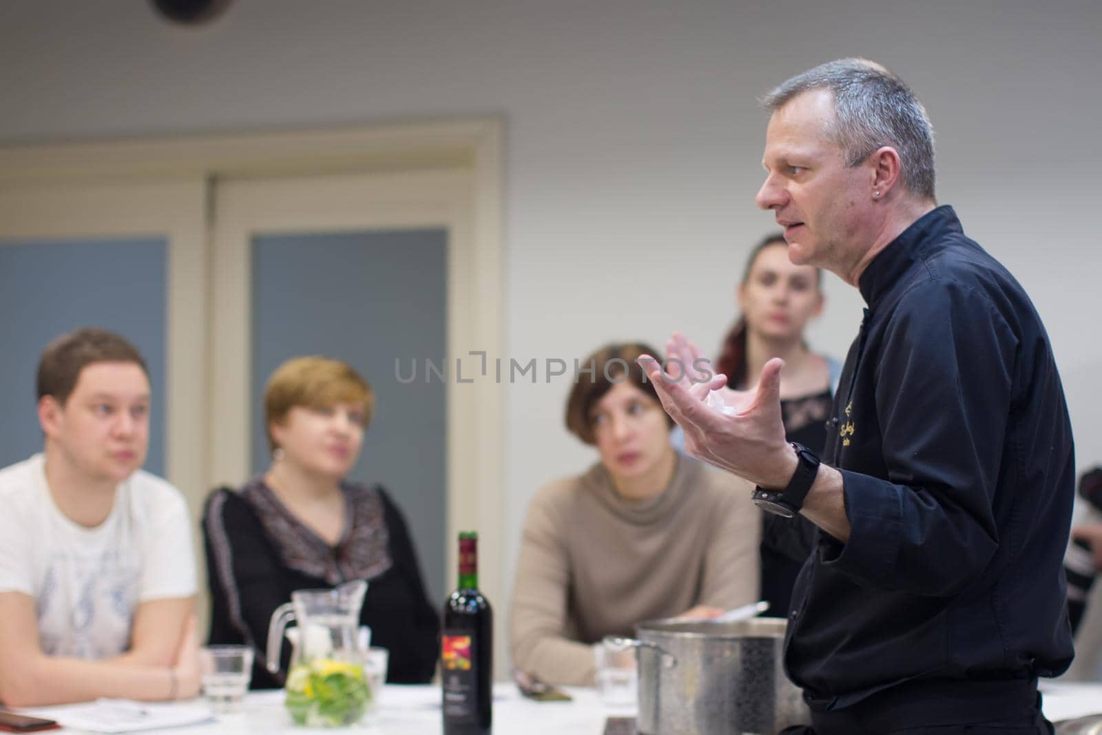 The cook teaches you how to cook food. Master class cooking. Chef looks at food