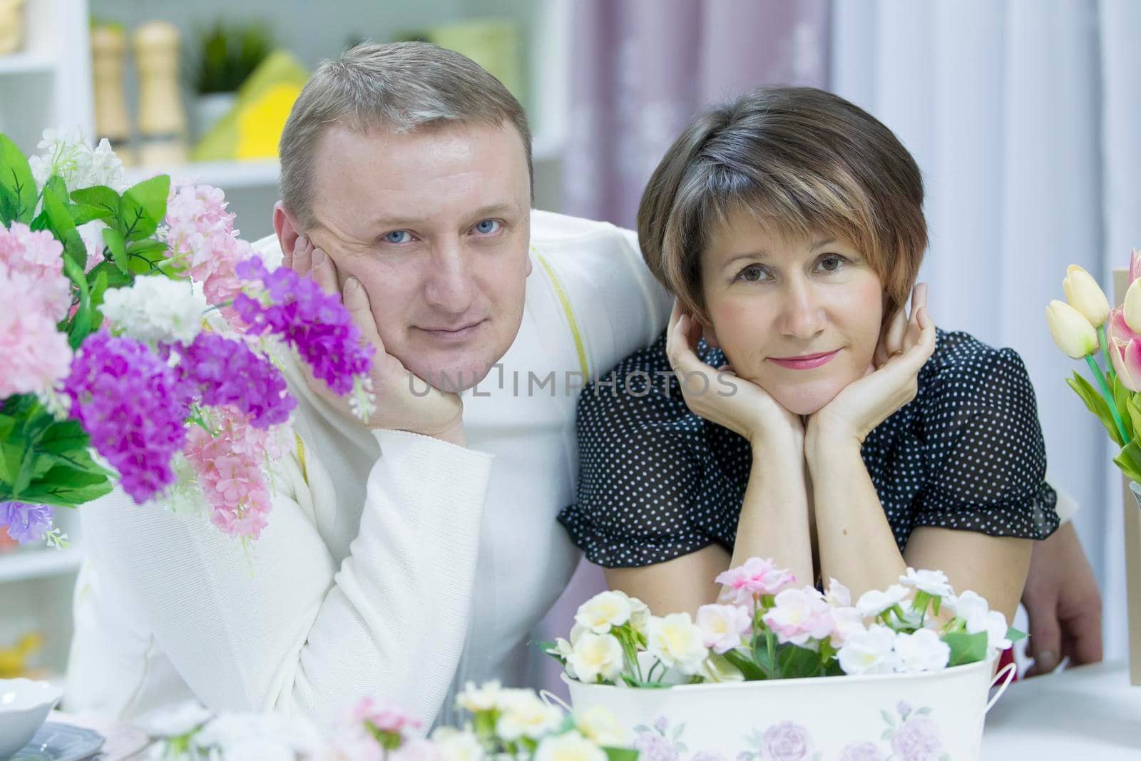 Husband and wife. Happy elderly couple. Love of middle age. A middle-aged man and a middle-aged woman.