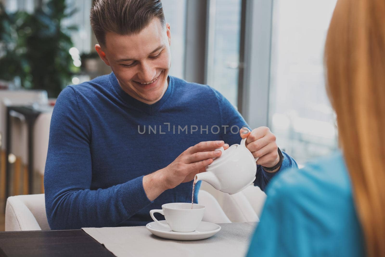 Lovely couple enjoying breakfast together at the restaurant by MAD_Production