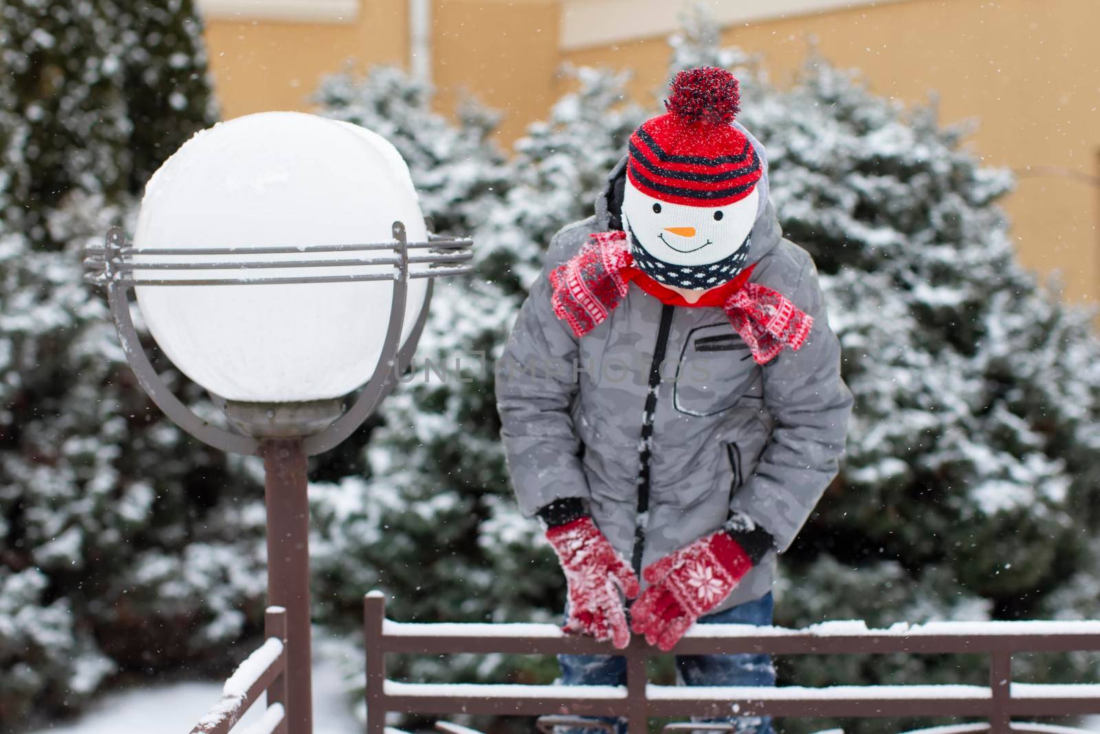 Child in winter. Little boy in a snowman hat.