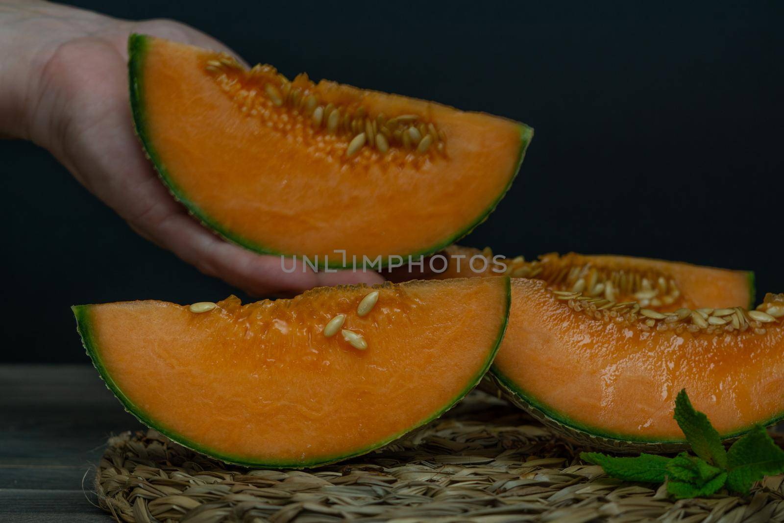 cantaloupe melon on black background dark food