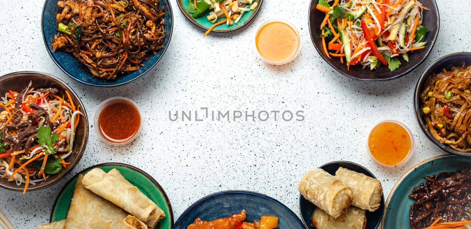 Set of Chinese dishes on white table copy space by its_al_dente