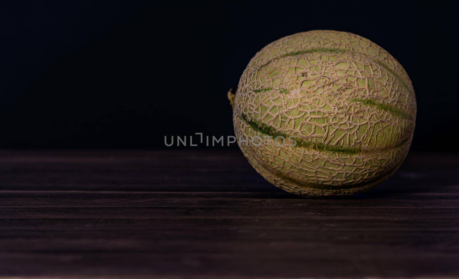 cantaloupe melon on black background dark food