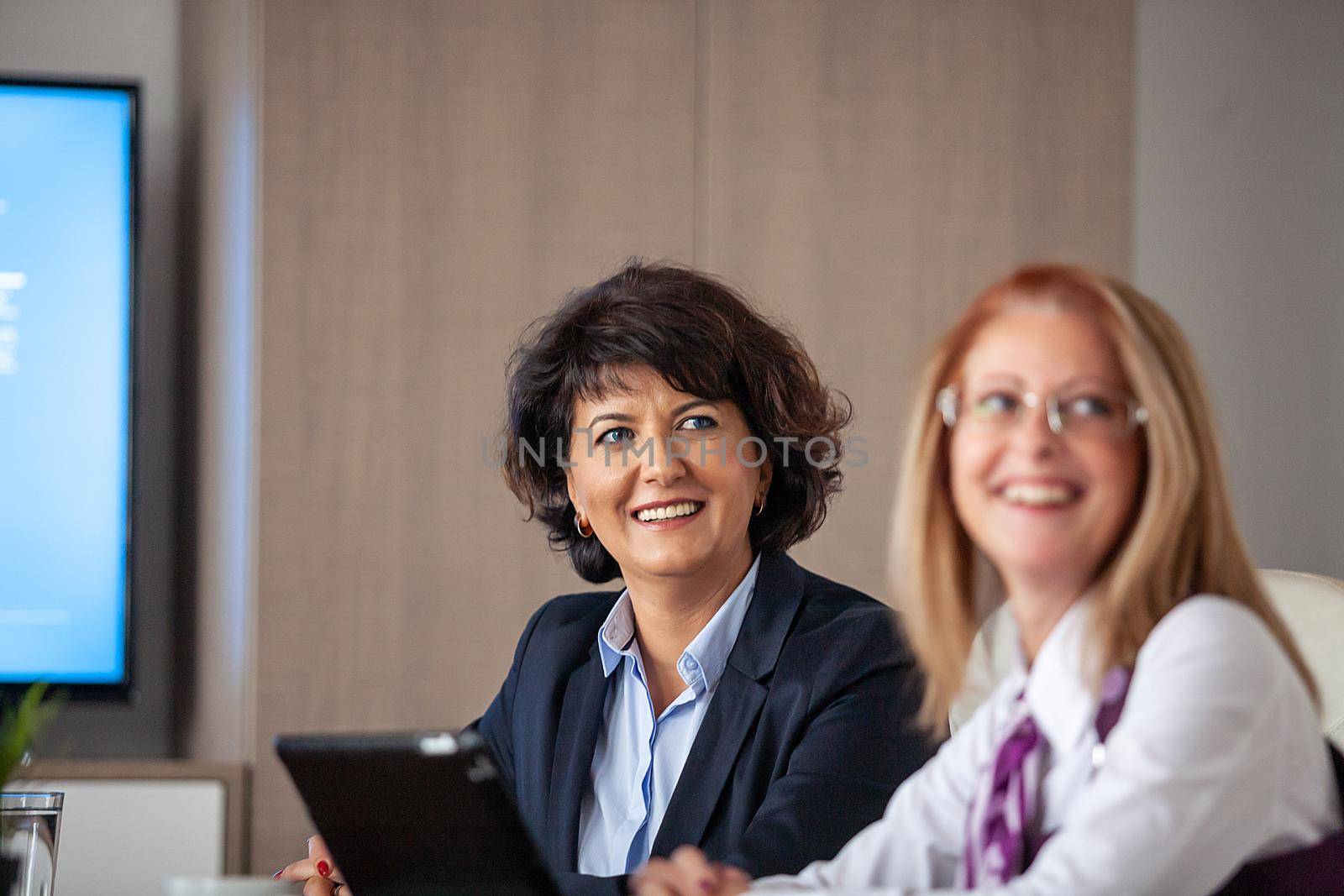 Succesful enterprenours and business people in conference room by DCStudio