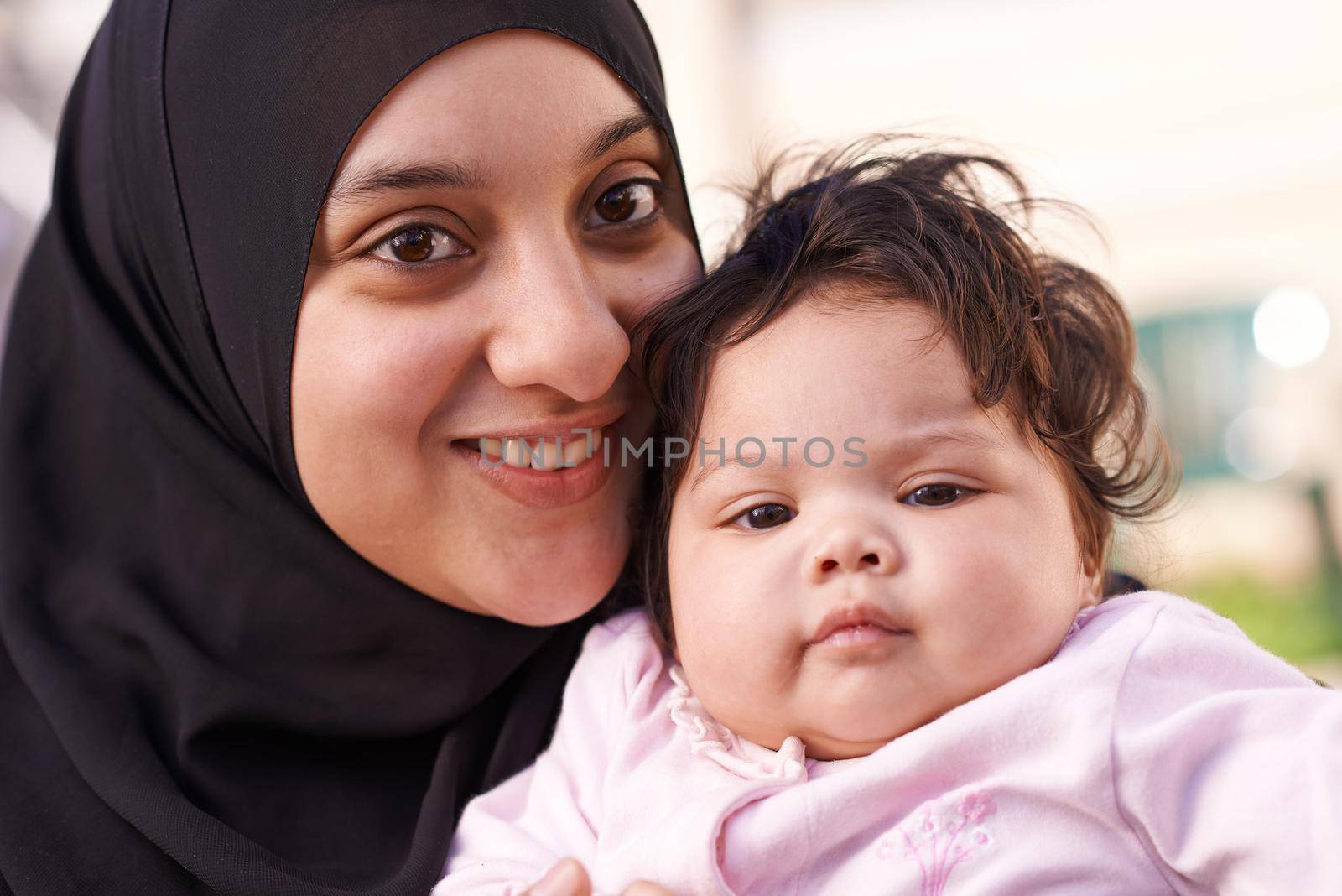 Moms little love. a muslim mother and her little baby girl