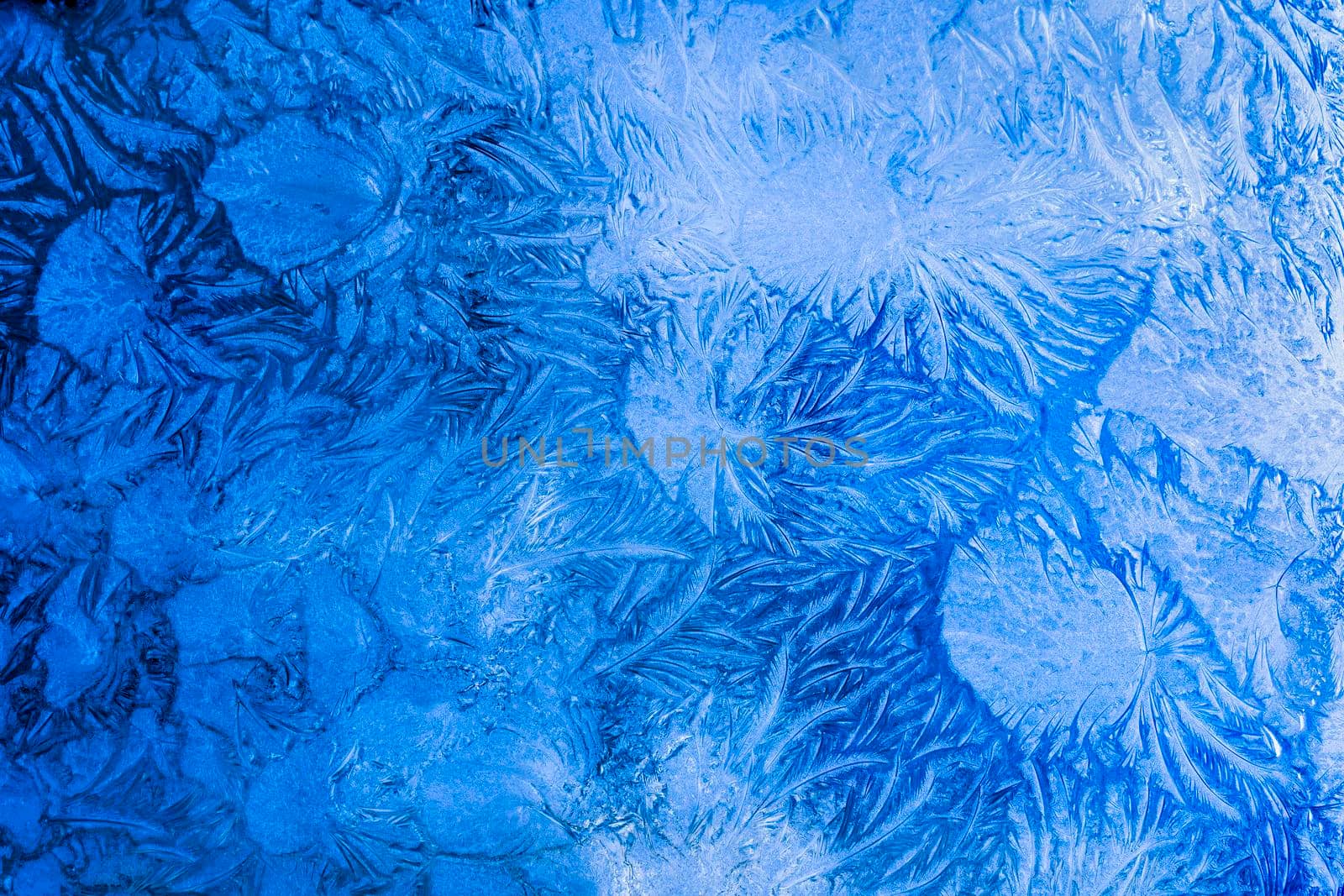 Abstract frosty pattern on glass, background texture on the window.