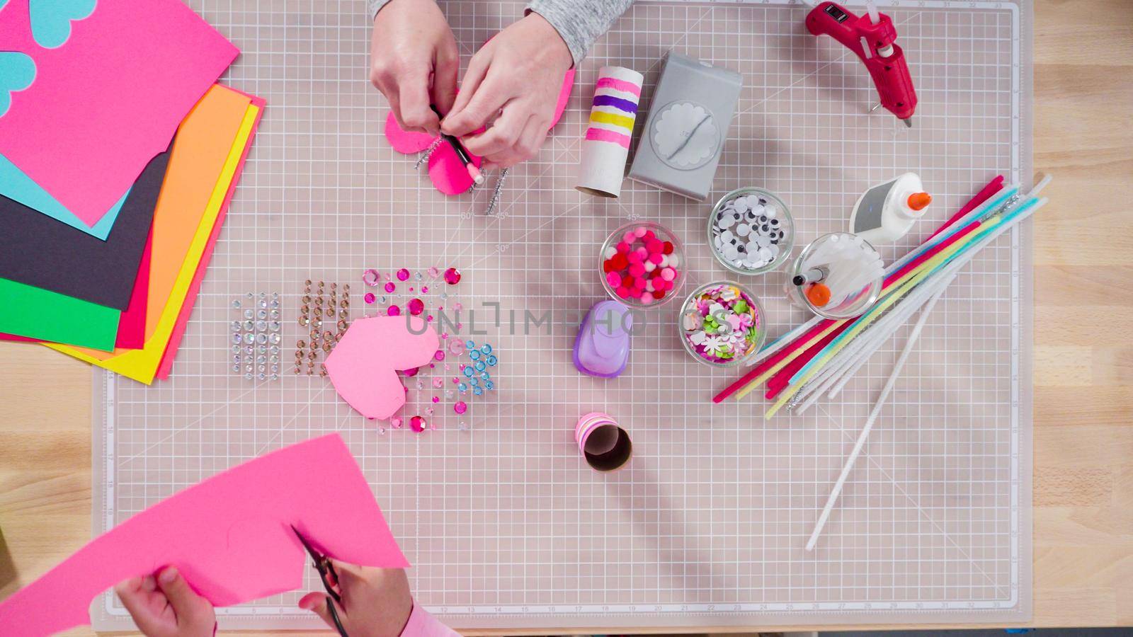 Flat lay. Kids papercraft. Making paper bugs out of the empty toilet paper rolls and construction paper.