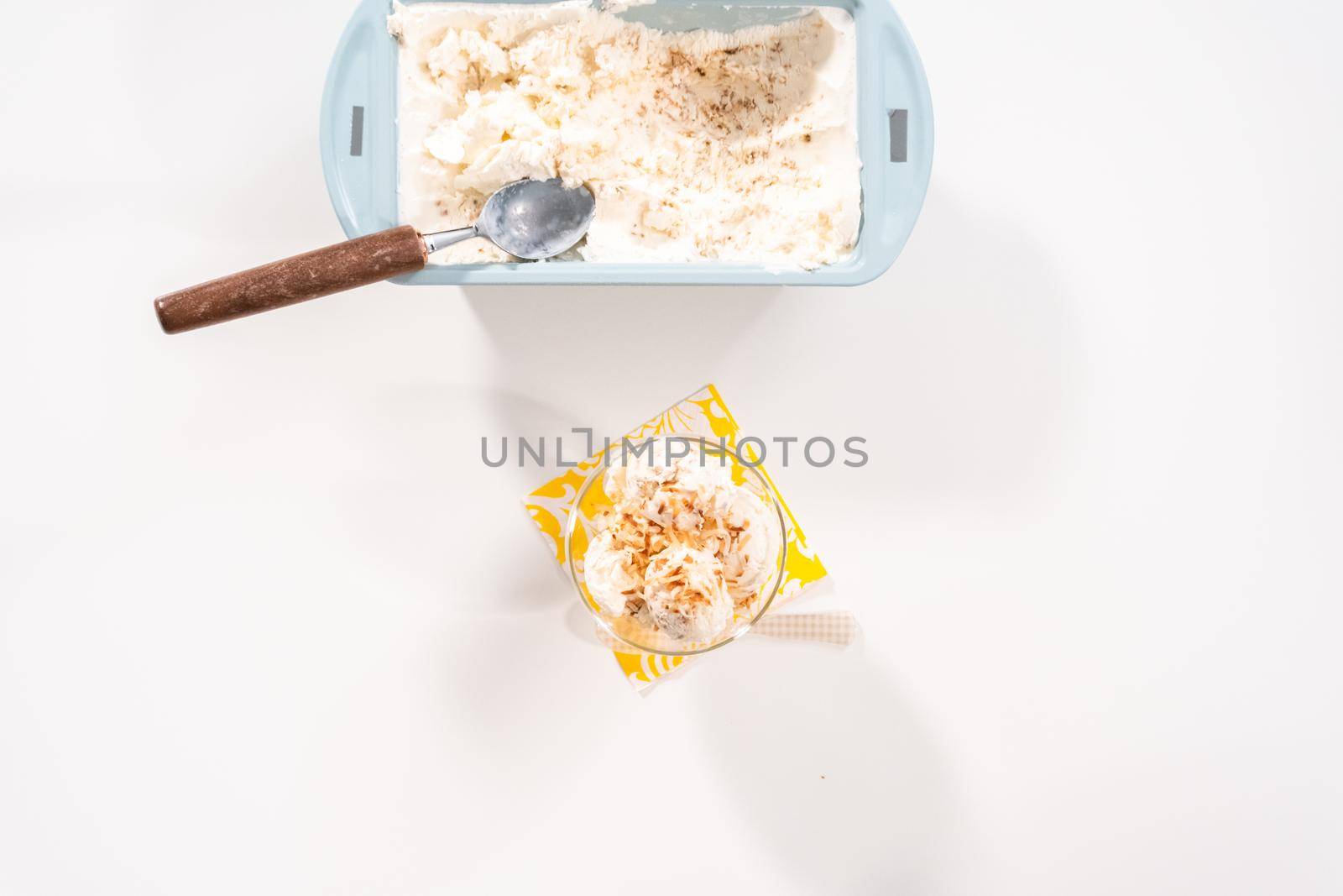 Flat lay. Preparing homemade coconut ice cream with roasted coconut flakes.