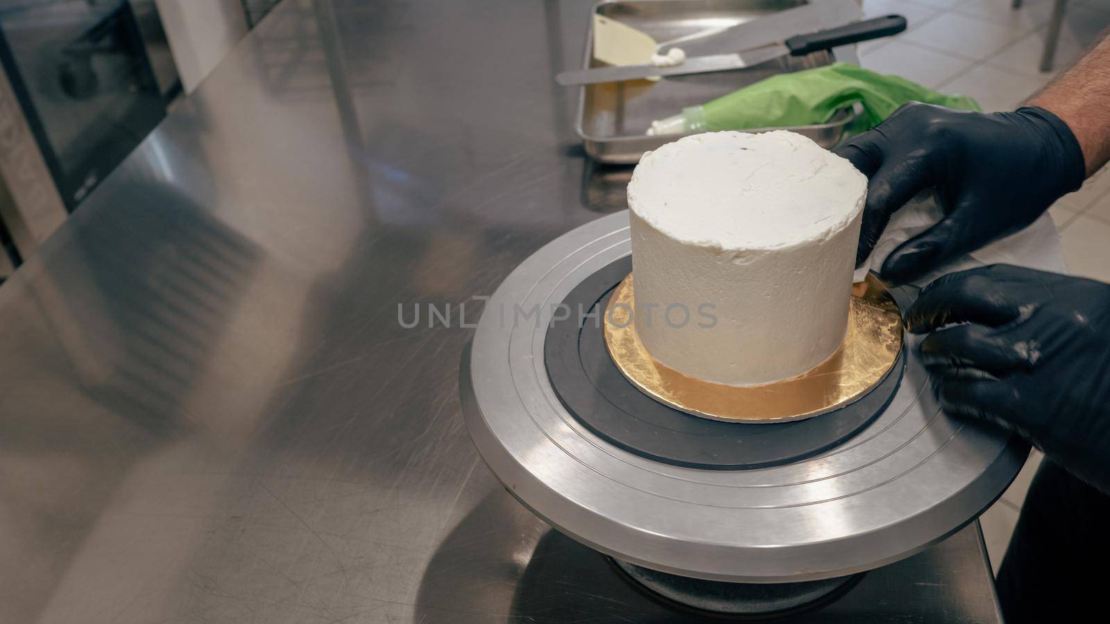 chef at work preparing a drip cake