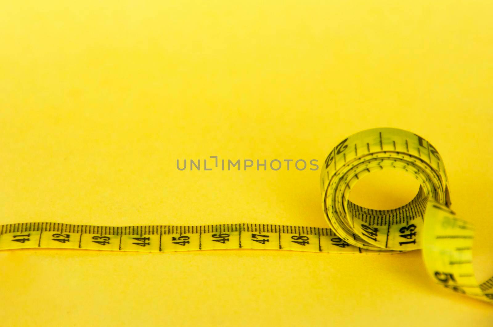 Measuring tapes with customizable space for text or ideas. Copy space and weight loss concept.