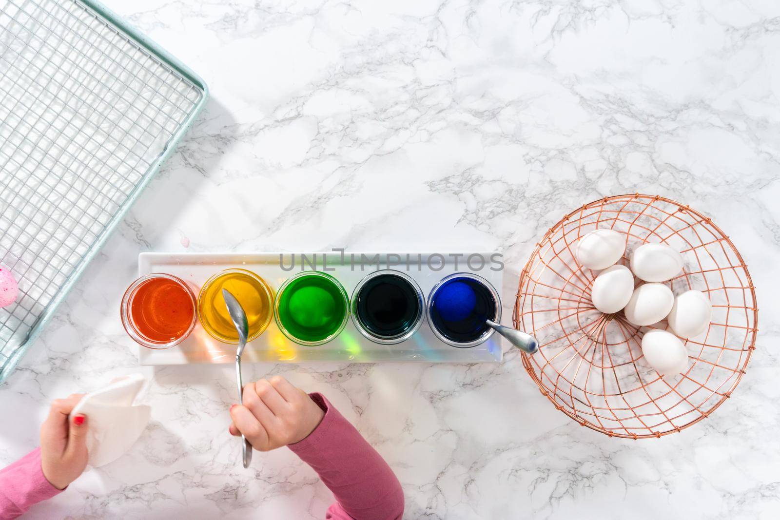 Flat lay. Easter egg coloring. Dye white organic eggs in different colors for Easter.