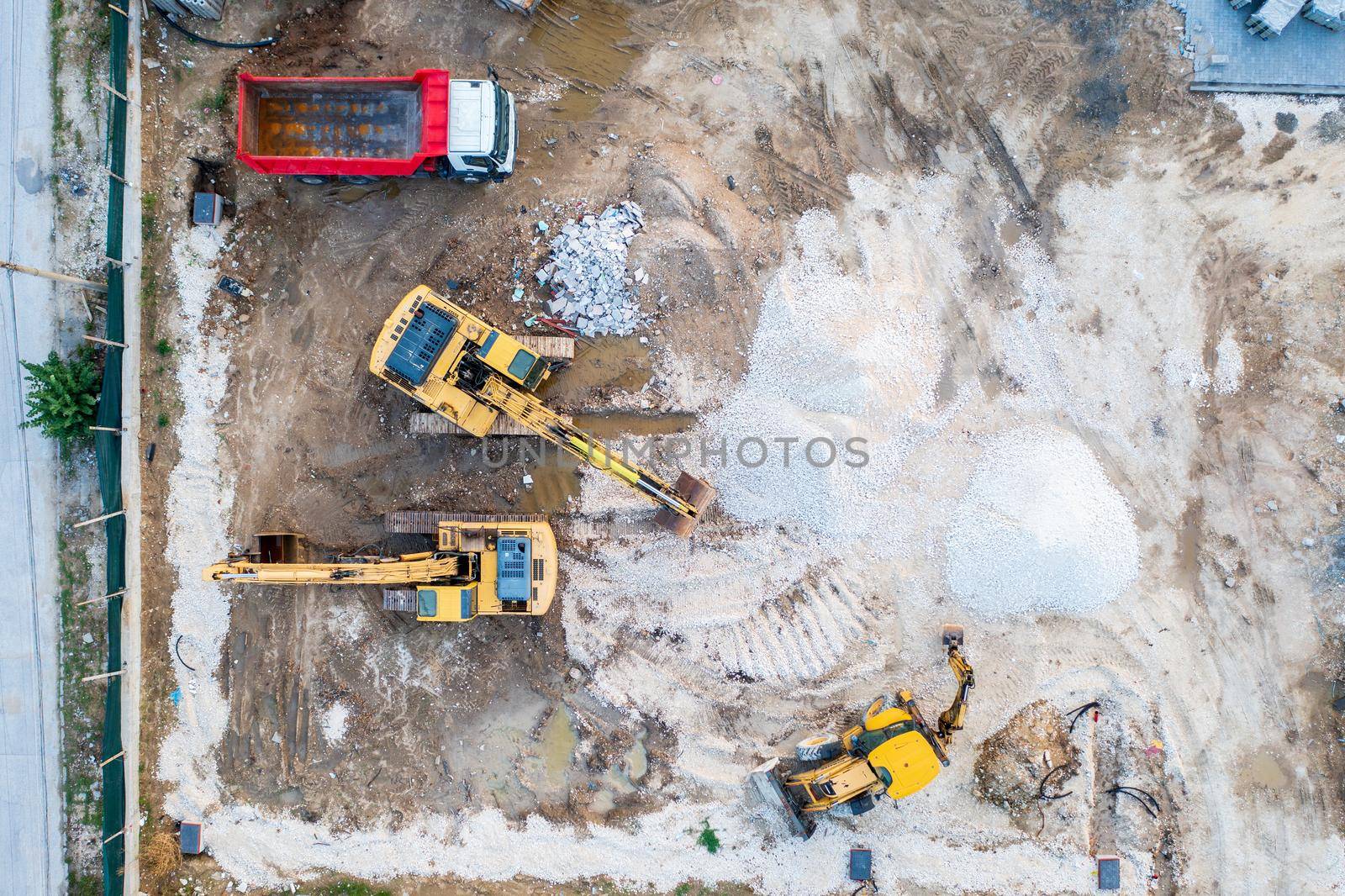 aerial top view of a construction site with heavy machines