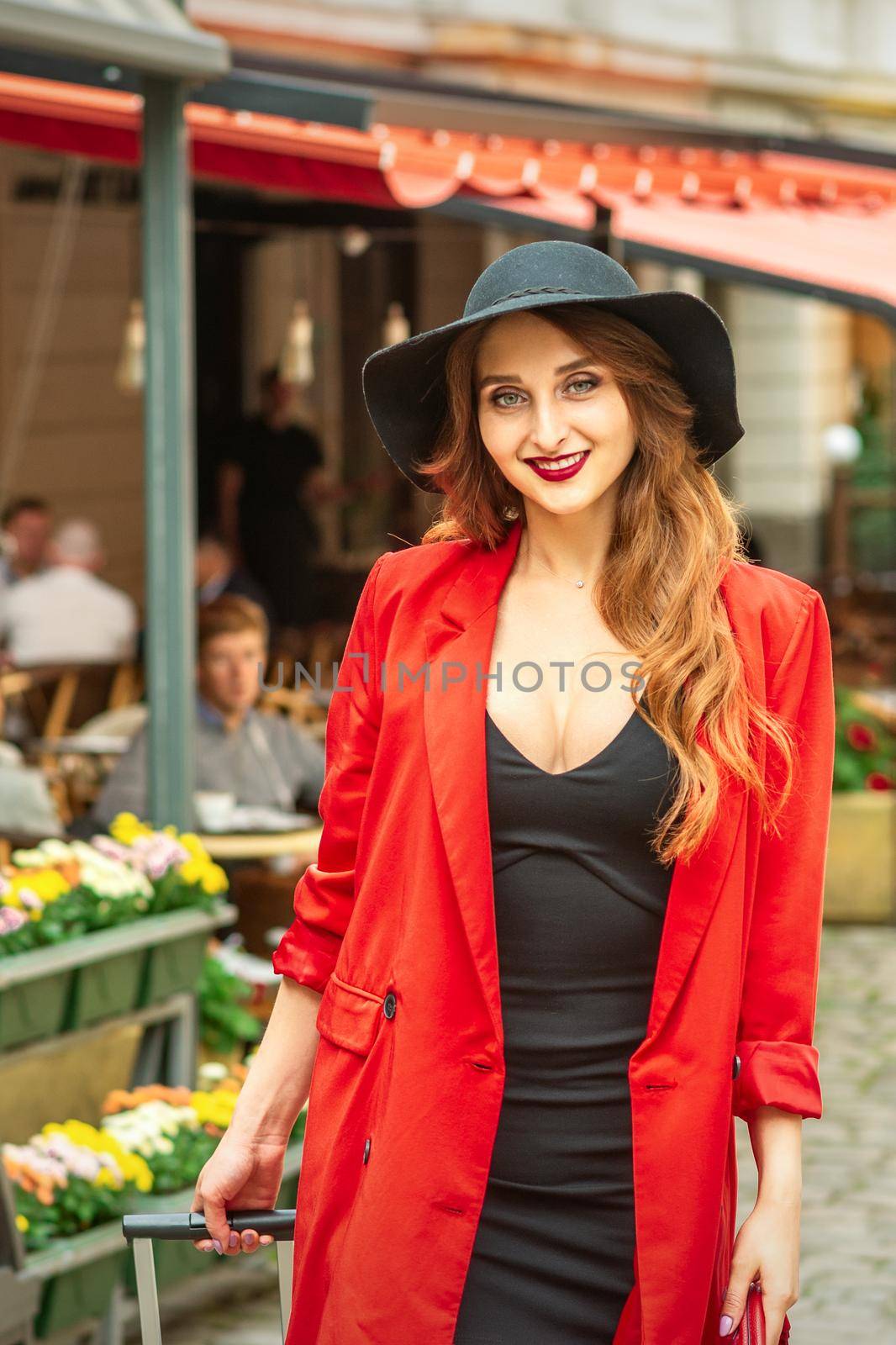 Woman is posing in the city street by okskukuruza