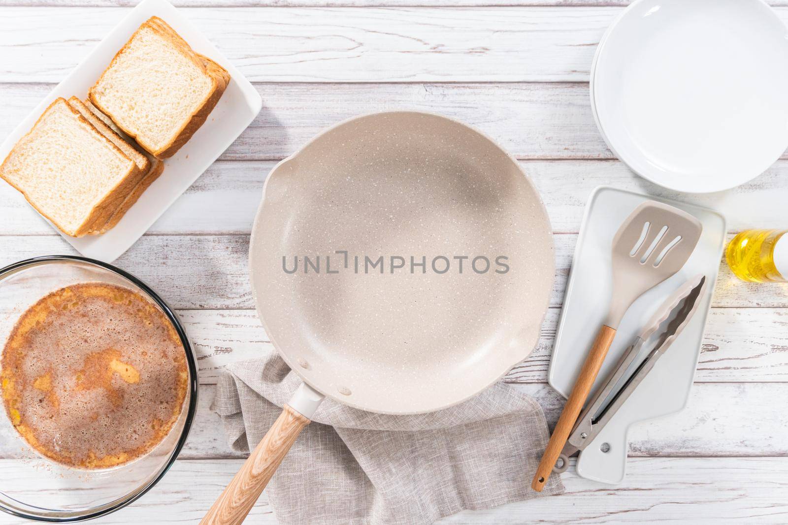 Frying french toast in a nonstick frying pan.