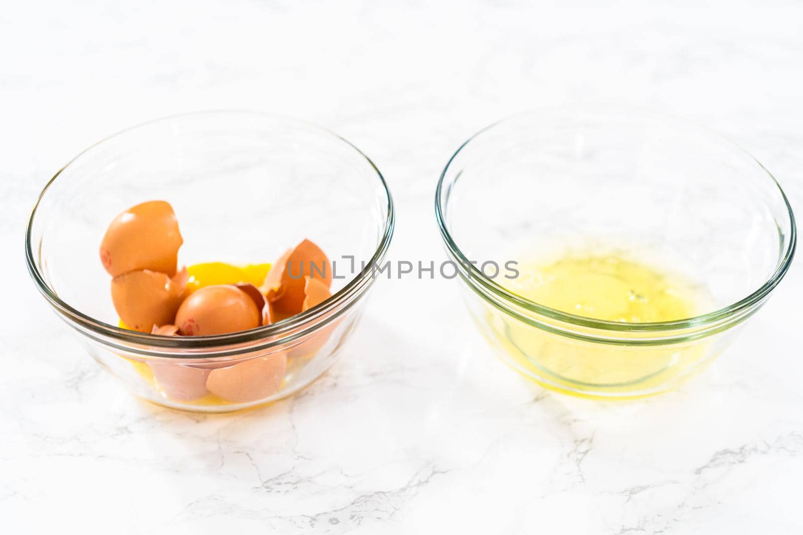 Separating egg whites and yolks to bake meringue cookies.