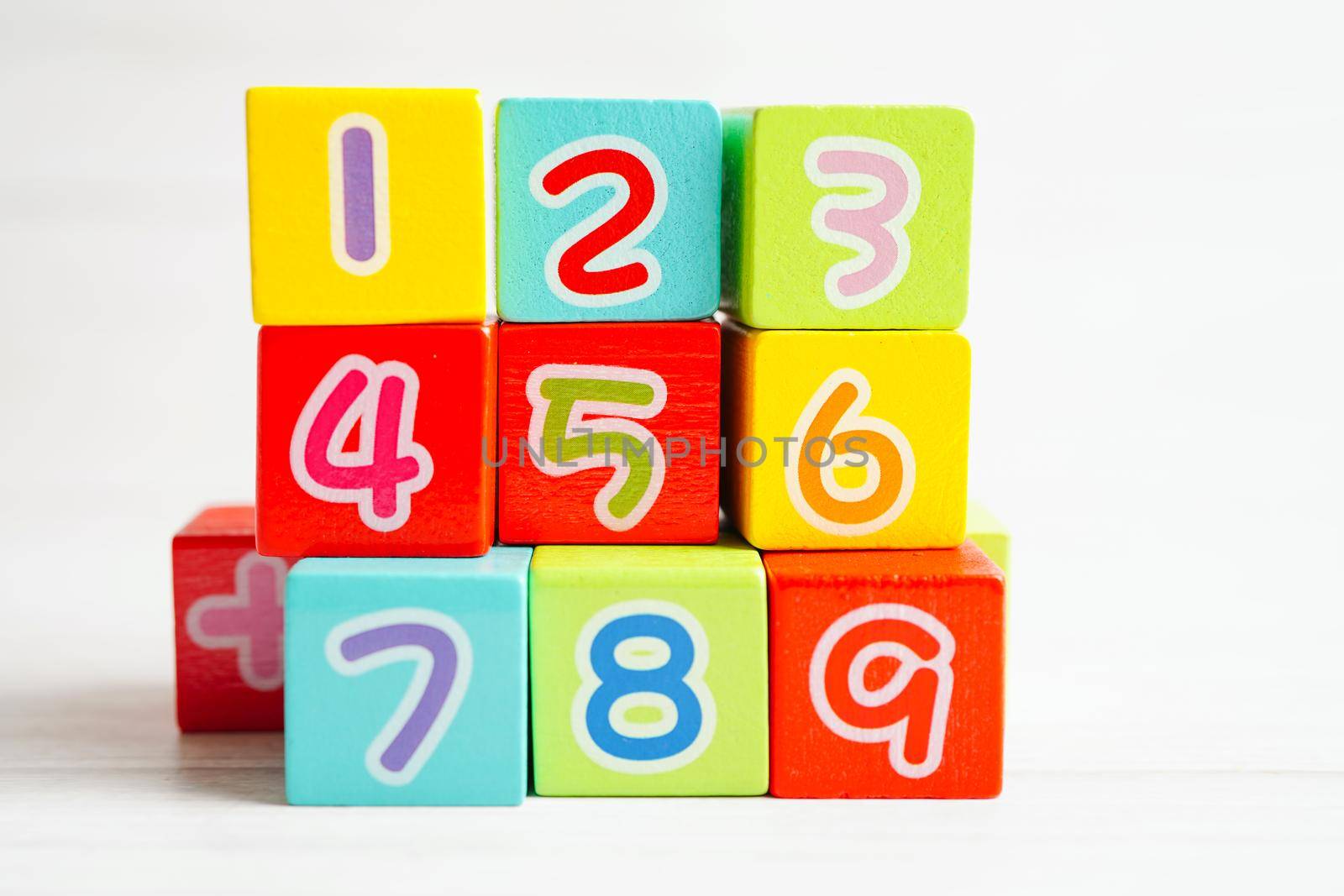 Number wood block cubes for learning Mathematic, education math concept.