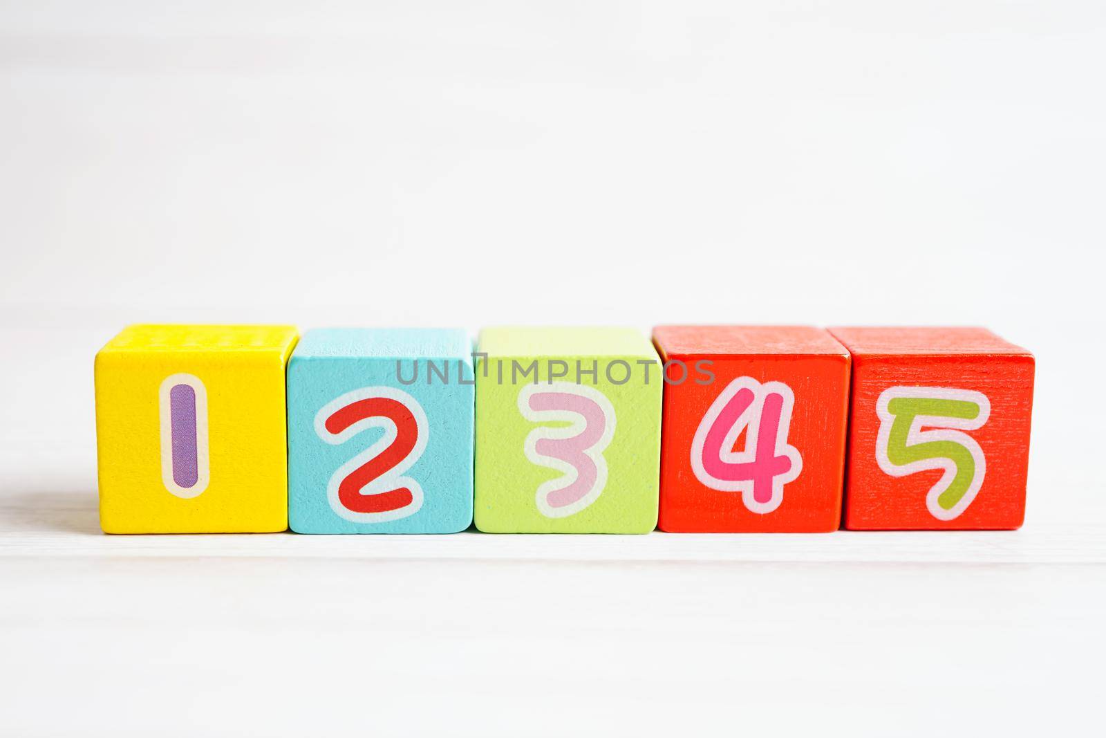 Number wood block cubes for learning Mathematic, education math concept.