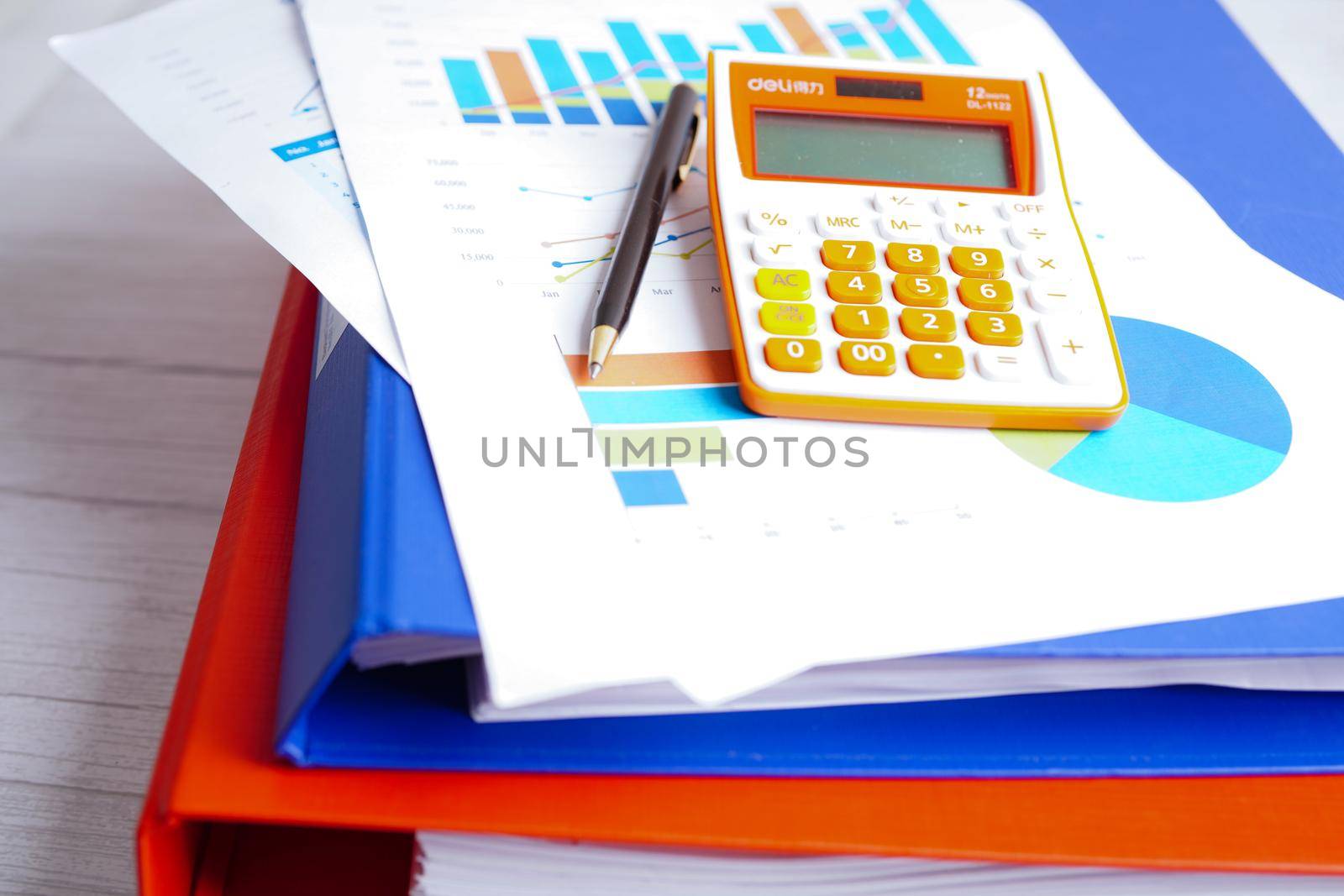 Calculator on chart and graph spreadsheet paper. Finance development, Banking Account, Statistics, Investment Analytic research data economy, Stock exchange trading, Business company concept.