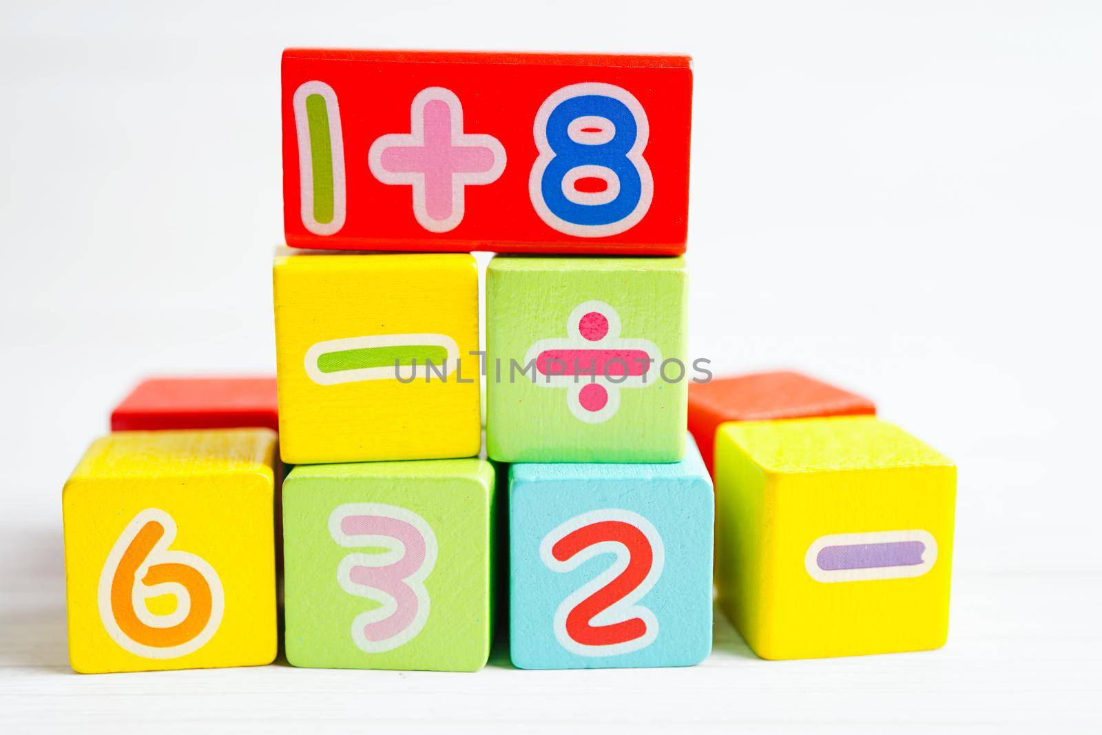 Number wood block cubes for learning Mathematic, education math concept.