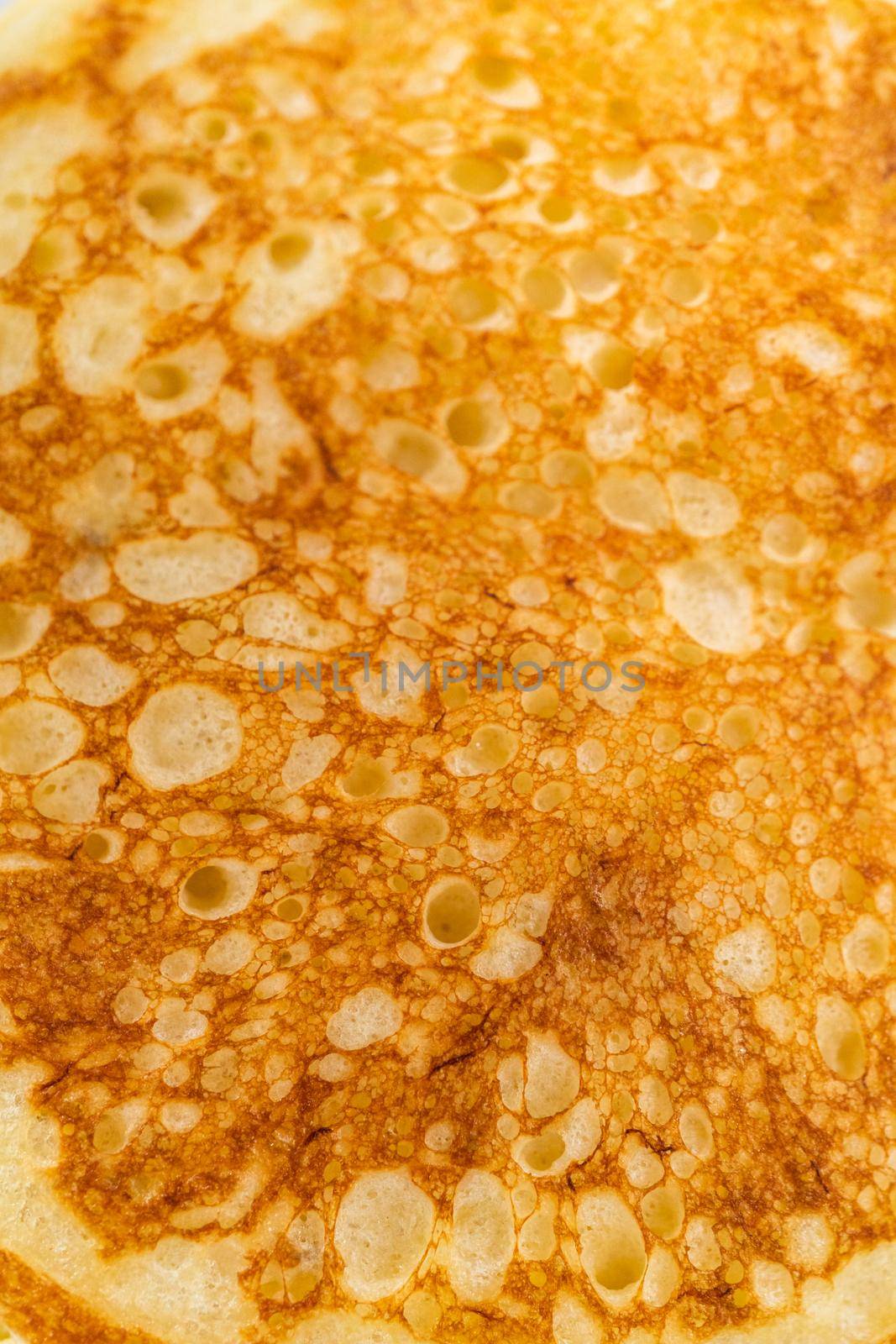 Trying coconut banana pancakes on a nonstick white frying pan.