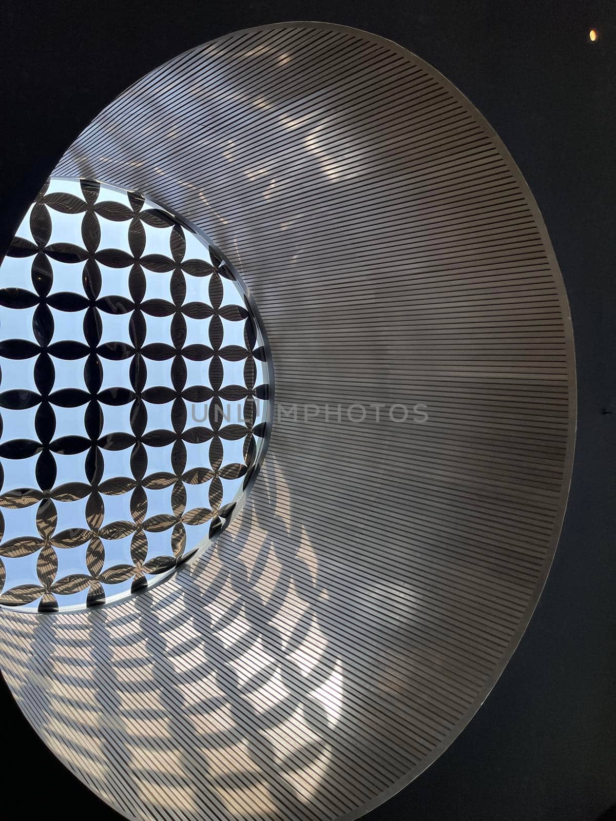 Interesting and unique artistic building roof pattern and texture for backgrounds against blue sky