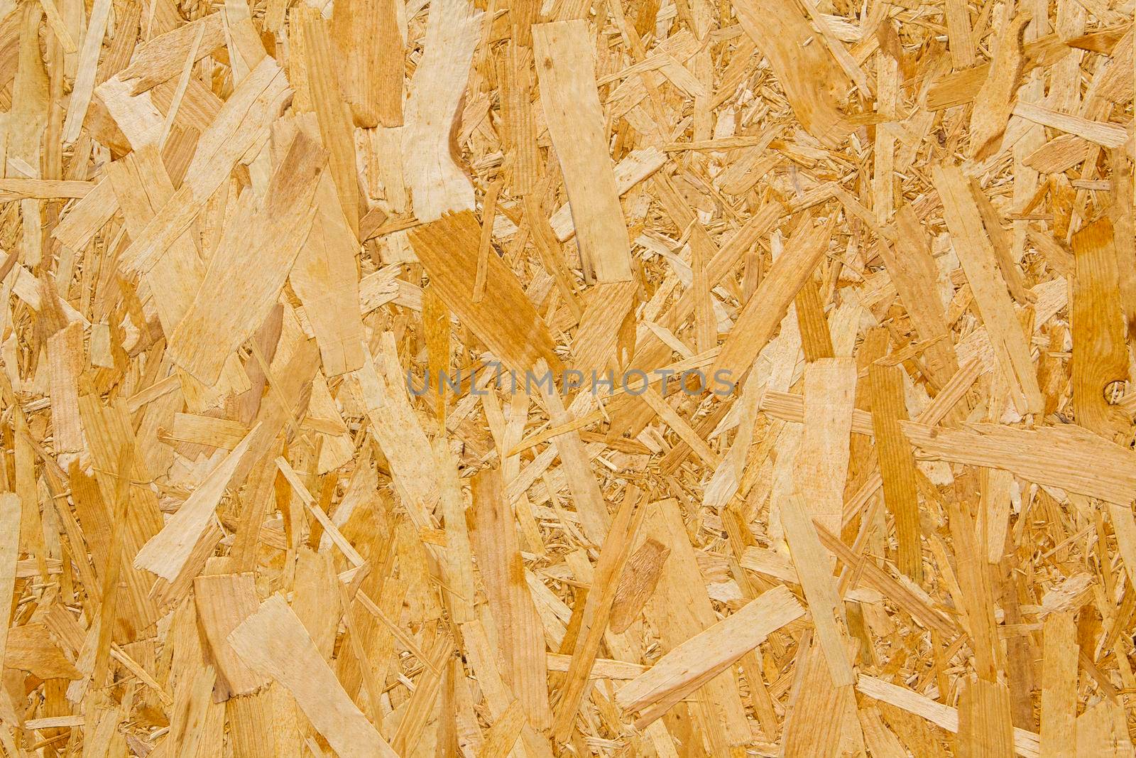 Pressed yellow wood chipboard background pattern texture. by gallofoto