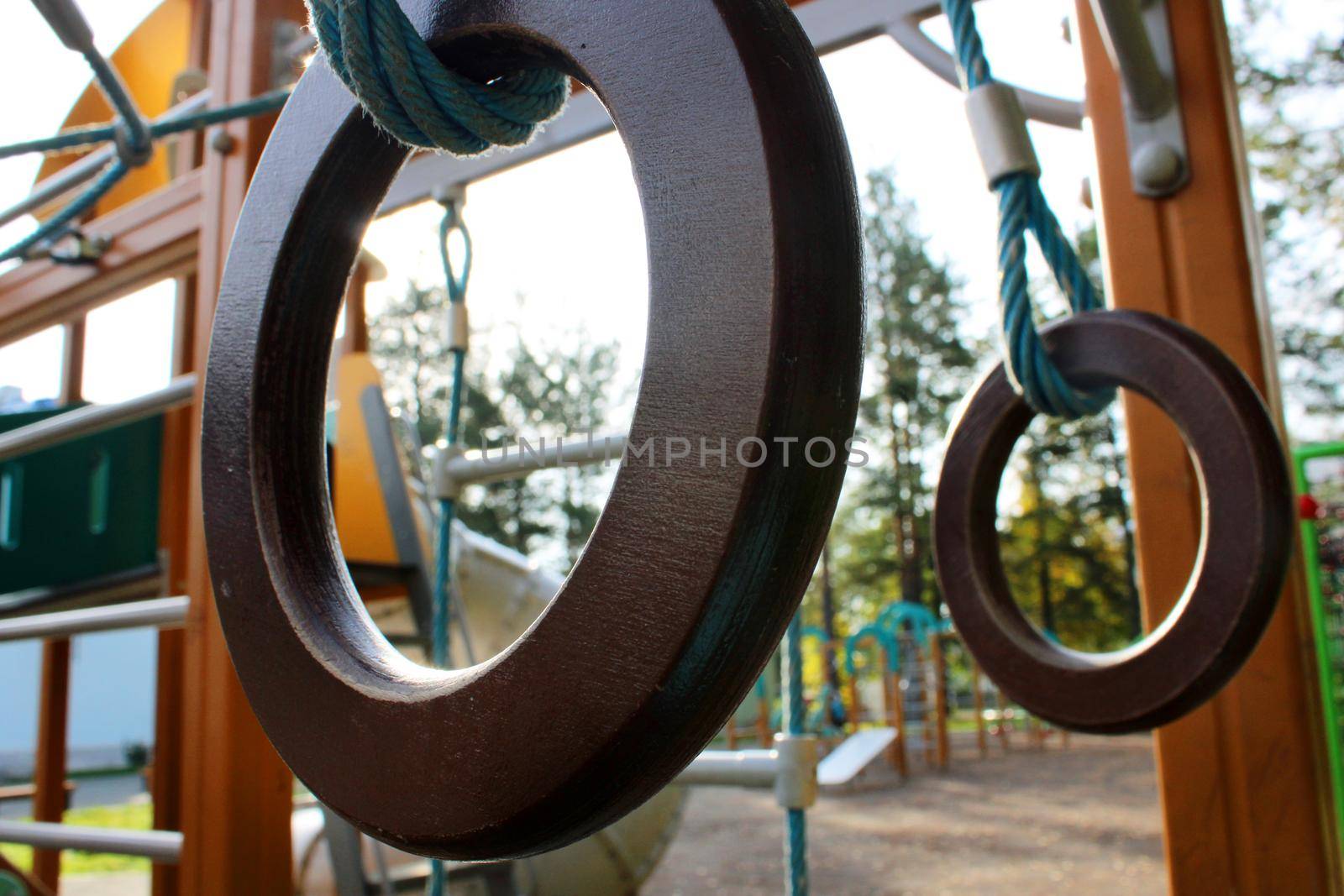 Gymnastic rings close-up on a children's outdoor playground. Healthy lifestyle concept