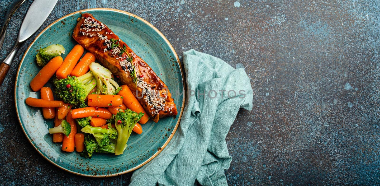 Grilled salmon fillet steak in teriyaki sauce with roasted vegetables carrot and broccoli by its_al_dente