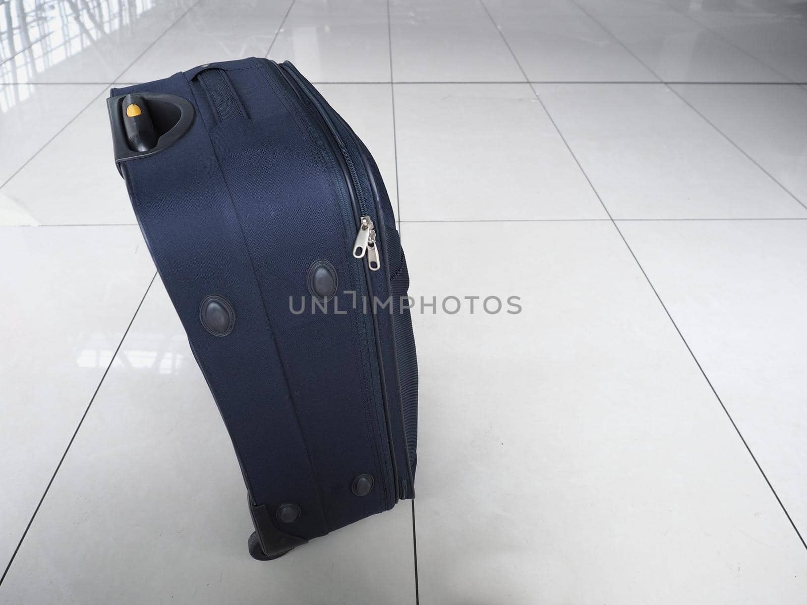 hand luggage suitcase on an airport floor
