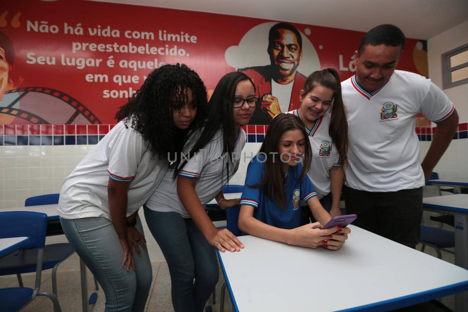 santana, bahia, brazil - september 13, 2022: students using smartphones in a classroom of a full-time state public school in the city of Santana.