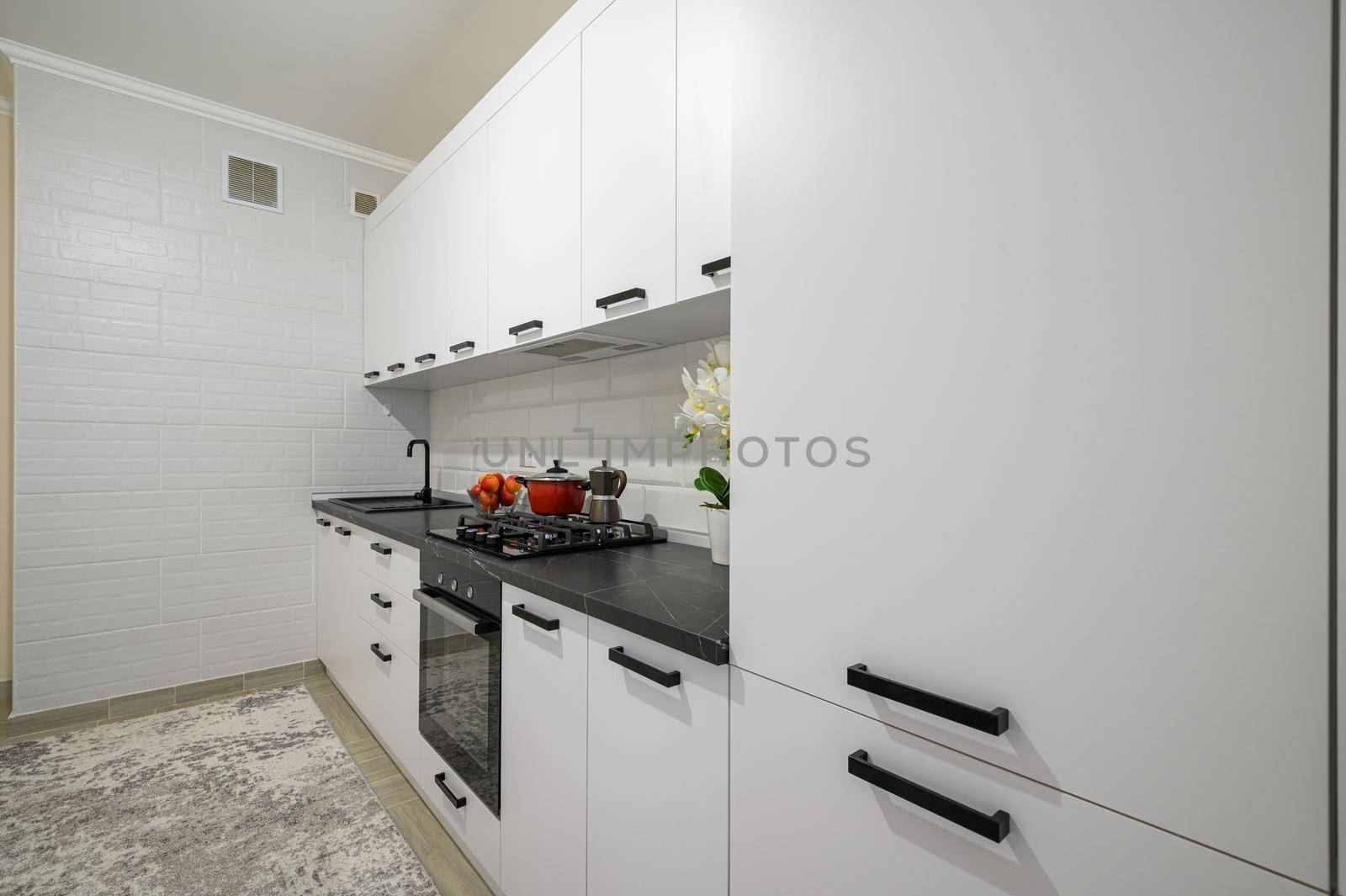 Trendy snow white modern kitchen interior showcase with minimalistic furniture