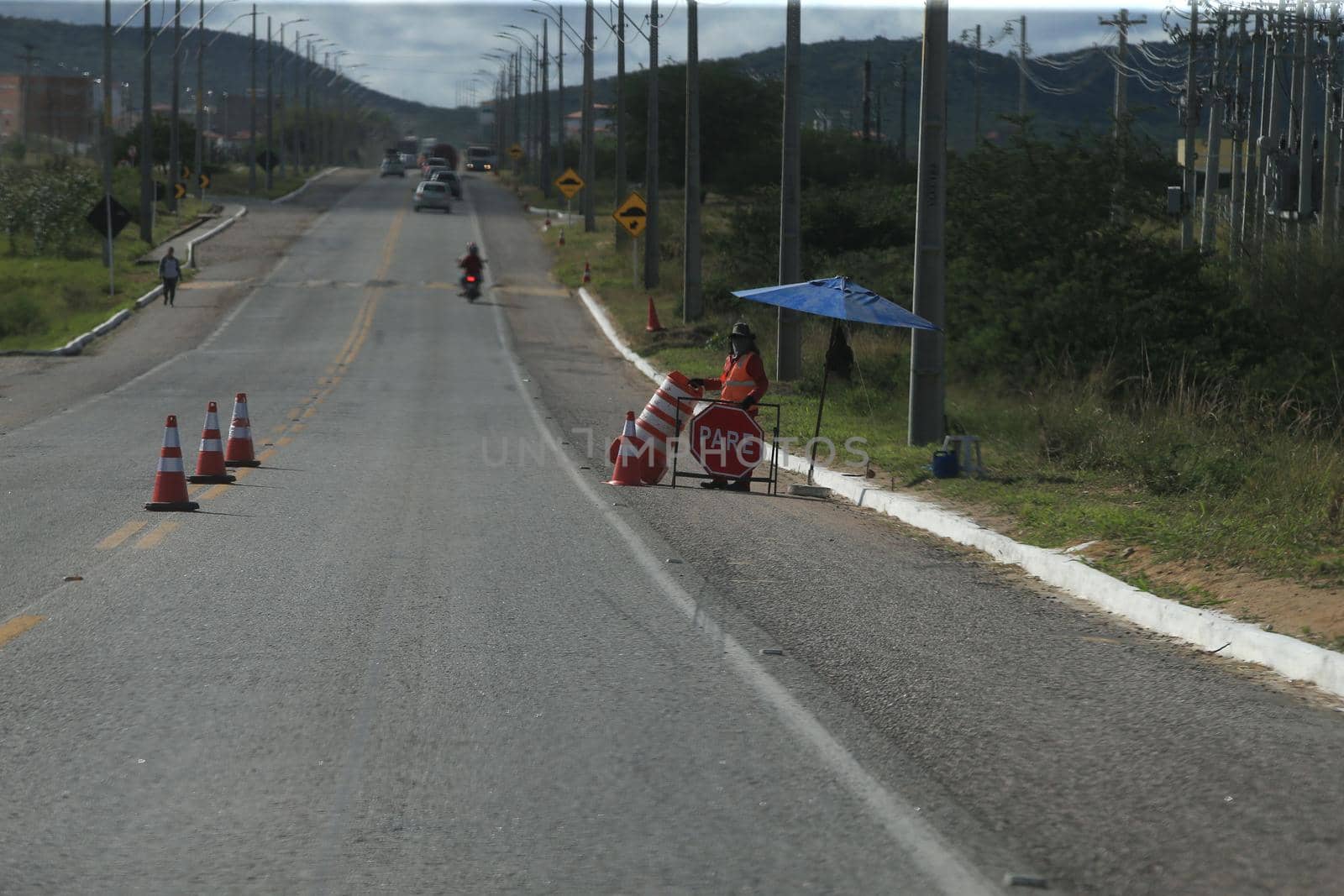 serra preta, bahia, brazil - september 13, 2022: workers recovering the BA 052 highway lane in the city of Serra Preta.