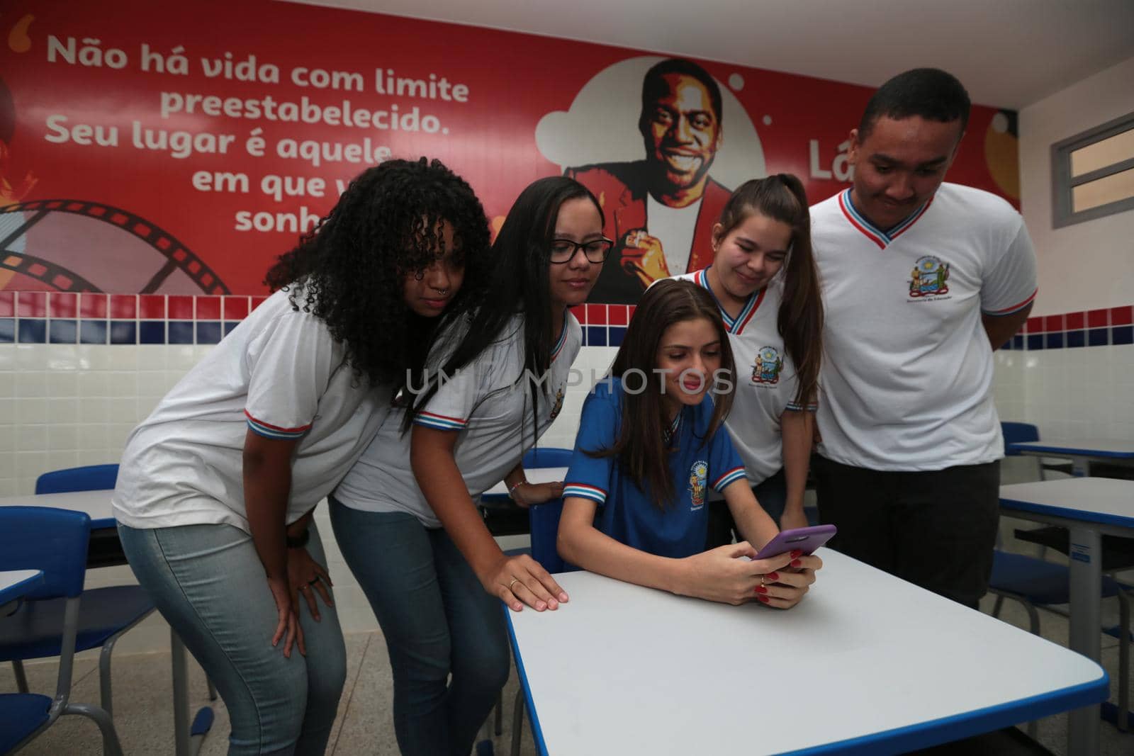 santana, bahia, brazil - september 13, 2022: students using smartphones in a classroom of a full-time state public school in the city of Santana.