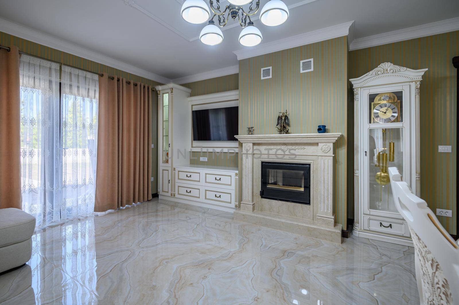 Classic living room interior design. Spacious room, luxury marble floor, elegant chairs and even fireplace
