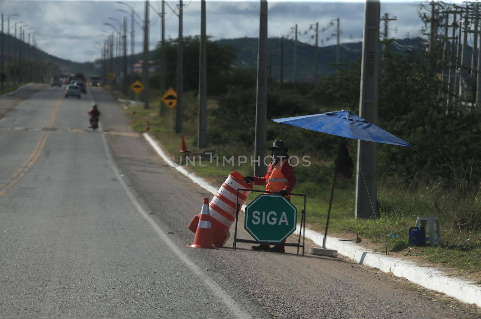serra preta, bahia, brazil - september 13, 2022: workers recovering the BA 052 highway lane in the city of Serra Preta.