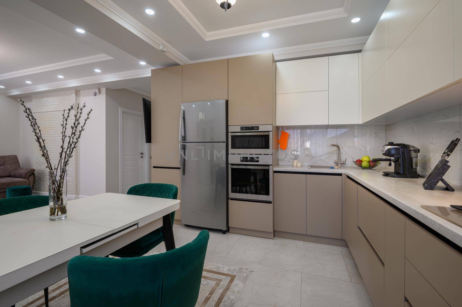 Modern classic white and beige luxurious kitchen with dining room in studio apartment interior
