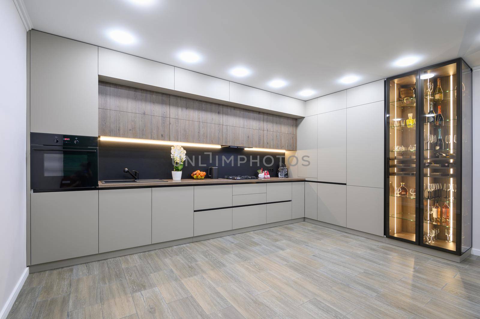 Trendy grey modern kitchen interior showcase with minimalistic furniture