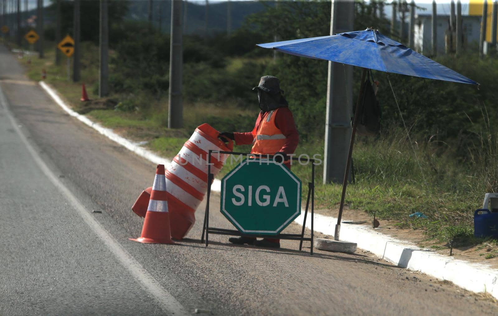 serra preta, bahia, brazil - september 13, 2022: workers recovering the BA 052 highway lane in the city of Serra Preta.
