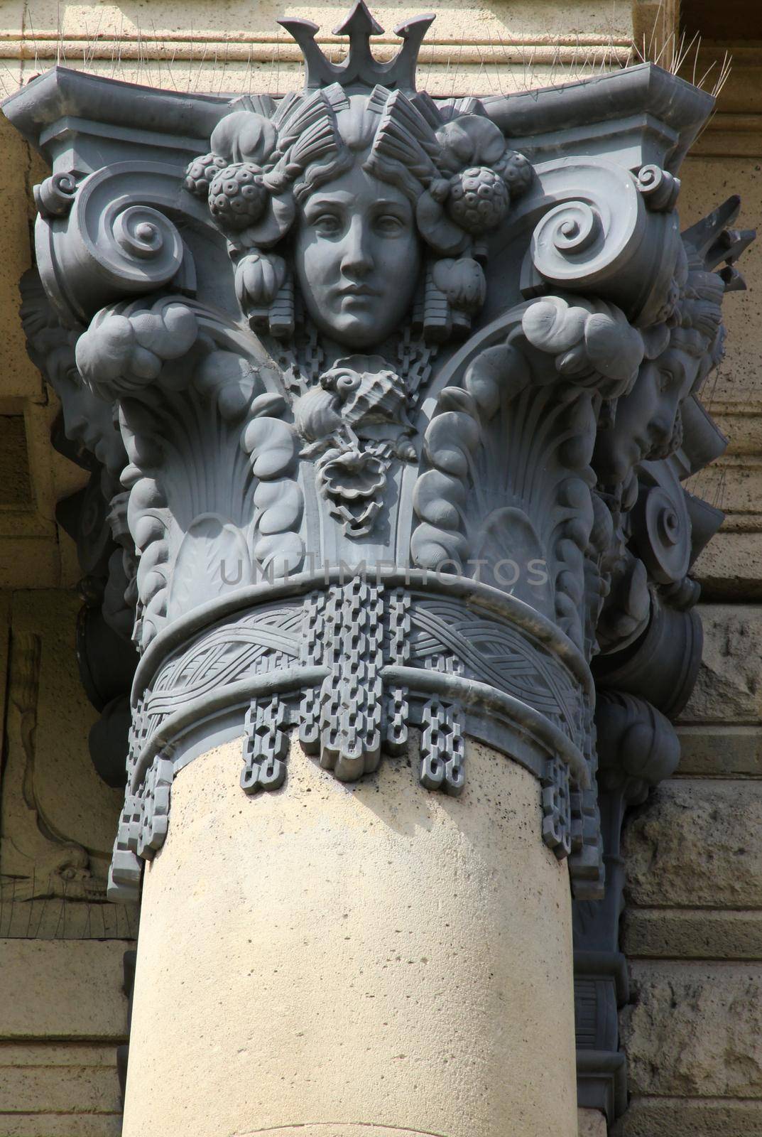 Metal column ornament with carved portrait of a woman. Szechenyi Bath Budapest, Hungary.