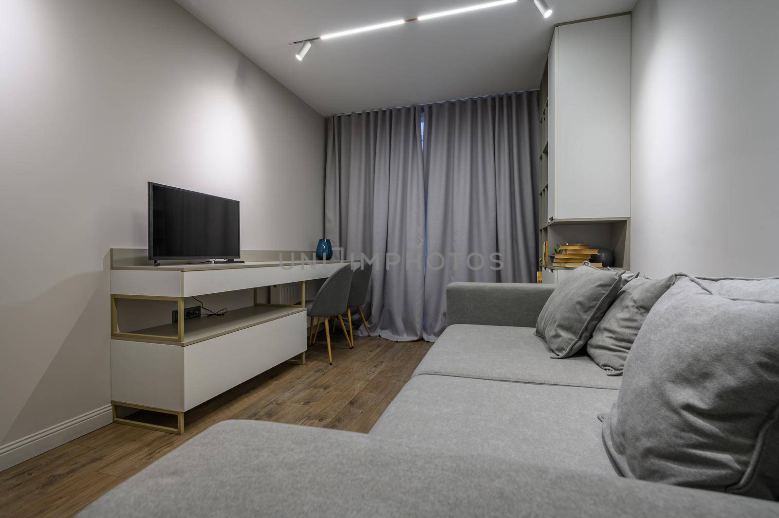 Cozy and luxury bedroom in shades of grey with elegant and modern details