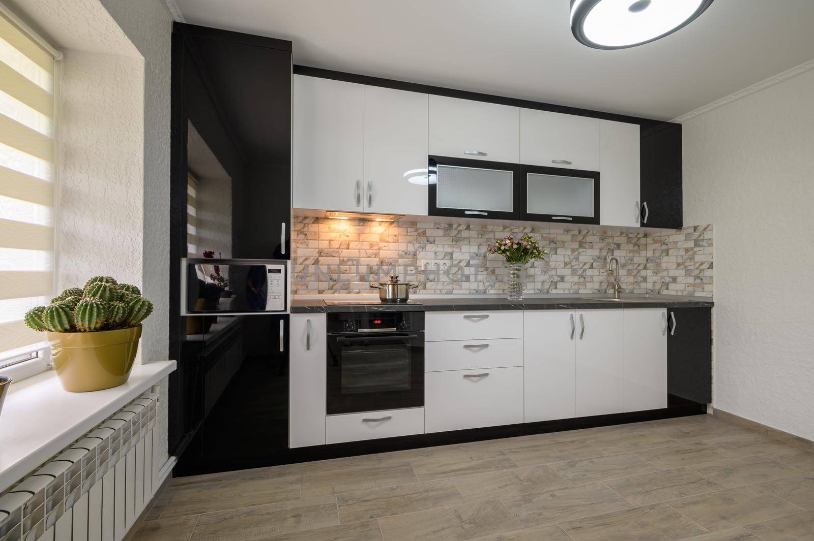 Interior renovation showcase of well designed modern trendy white kitchen